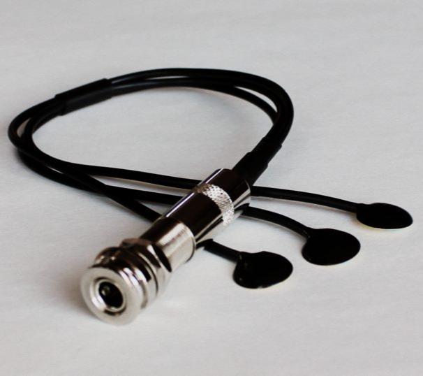 A black JJB Electronics Prestige 330 acoustic pickup system for guitars, featuring a triple surface transducer design with a nickel-plated end-pin jack and two strap buttons.