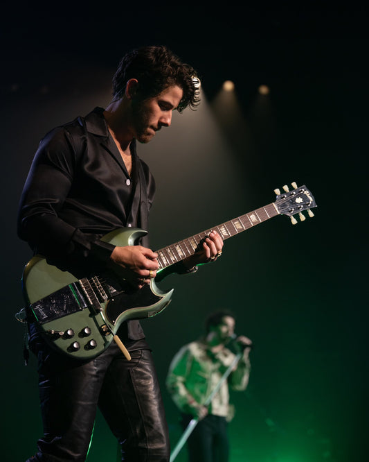 Nick Jonas of the Jonas brothers with Gibson SG refretted by Feline Guitars